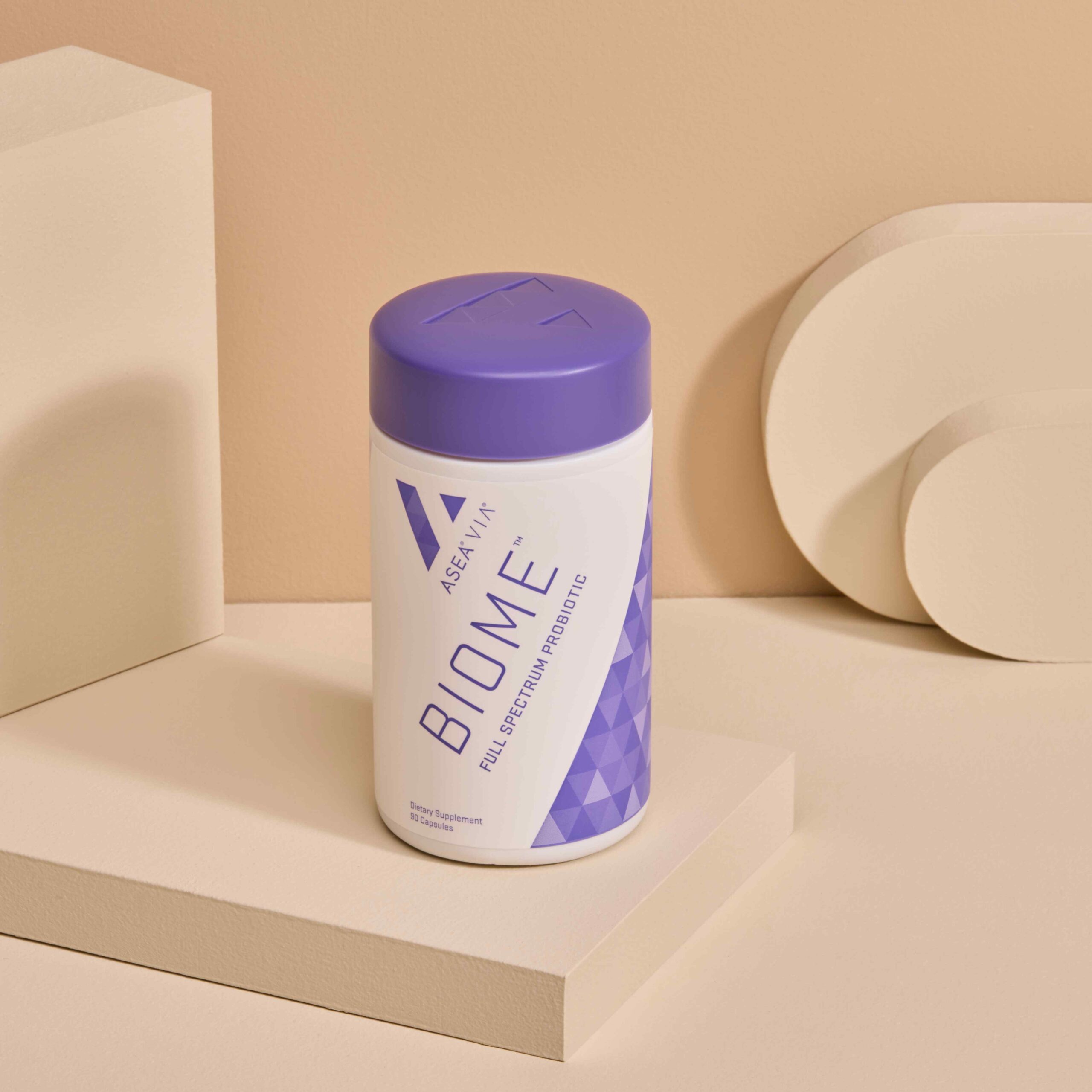 The ASEA VIA Biome supplement displayed clearly, representing a science-backed probiotic and prebiotic solution designed to support digestive comfort and microbiome balance.