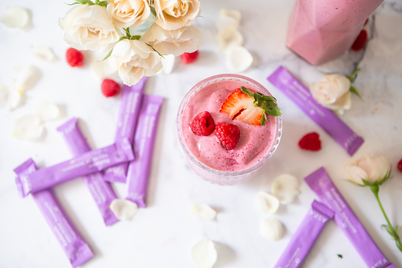 A styled collagen support smoothie paired with fresh fruit elements, representing a consistent beauty-from-within routine.