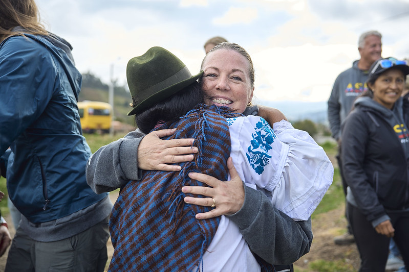 ASEA Advancing Life Foundation volunteer embracing a local community member during a women's empowerment and community support initiative.